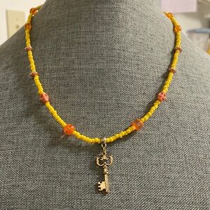 Yellow Orange Beaded Necklace with key Pendant